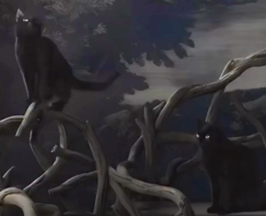Currey and Company showroom vignette with black cats on antler furniture against a moonlit painted landscape